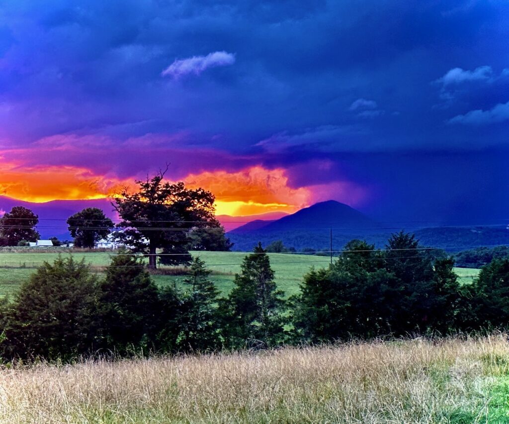Fiery sunset over mountain range.